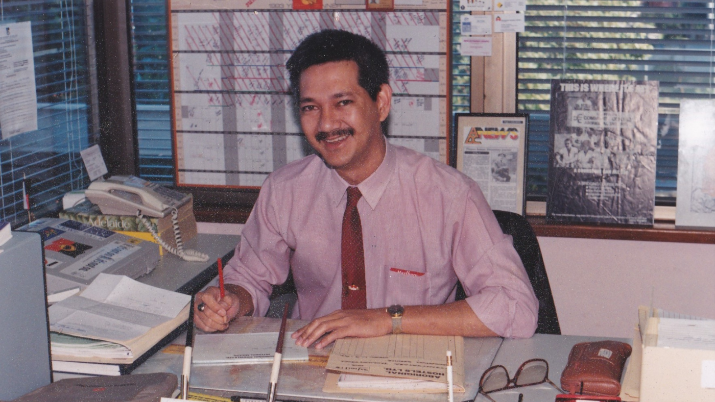 Ronald Jan sitting at this desk.