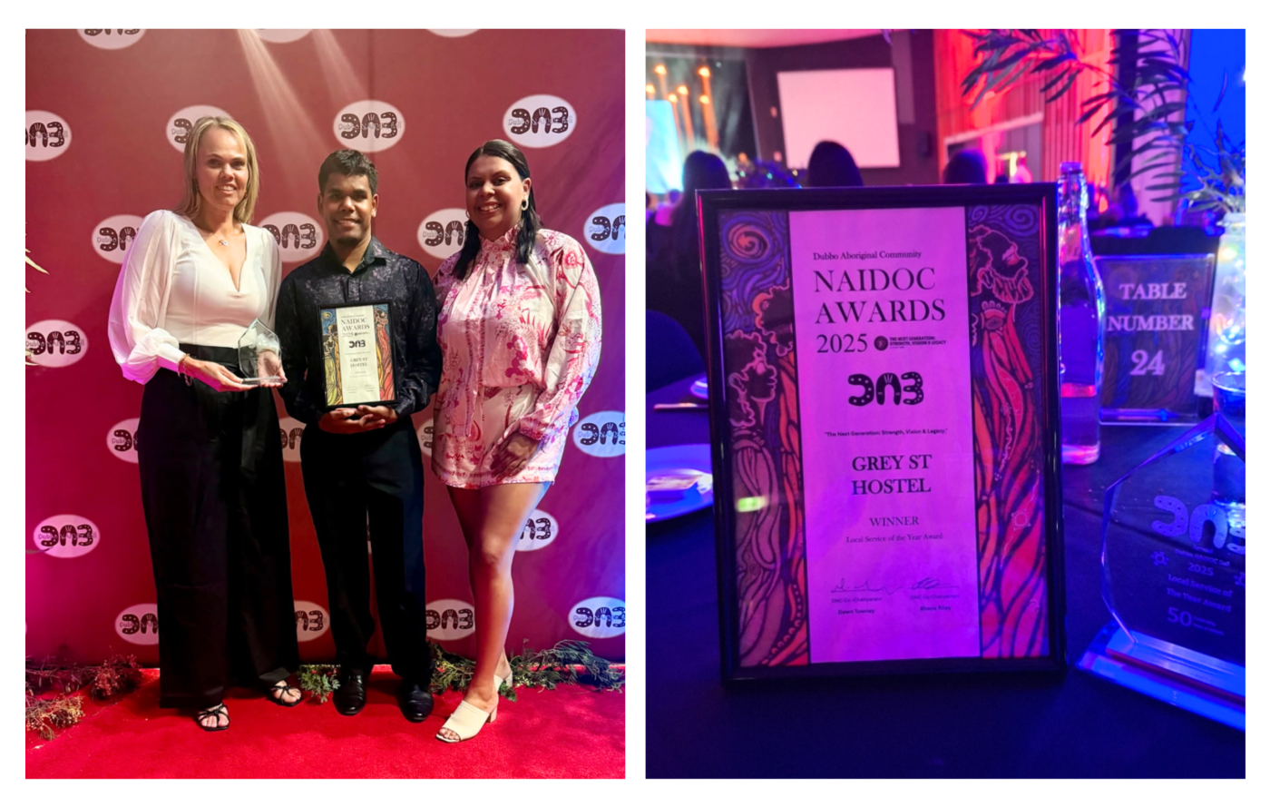 Three people standing, holding the NAIDOC award